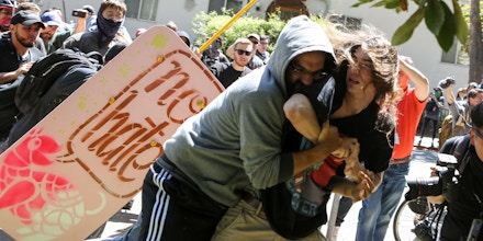No-To-Marxism rally members and counter protesters clash on August 27, 2017 at Martin Luther King Park Jr. Civic Center Park in Berkeley, California. / AFP PHOTO / Amy Osborne        (Photo credit should read AMY OSBORNE/AFP/Getty Images)