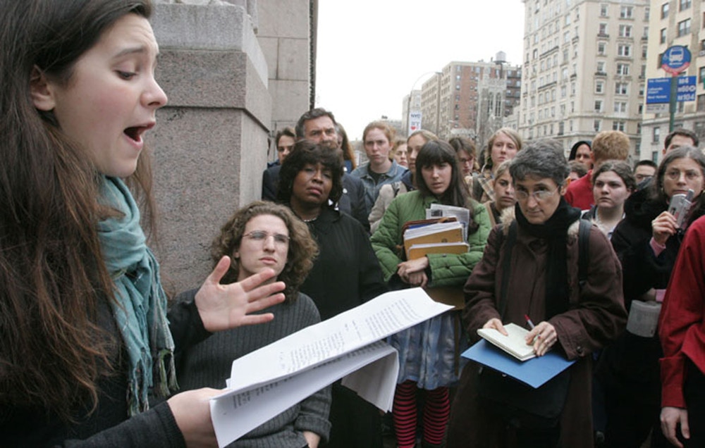 Bari Weiss, left, a sophmore at Columbia Univerity, speaks at a press conference organized by Columbians for Academic Freedom as a crowd listens outside the gates to Columbia University in New York Thursday March 31, 2005.  Weiss, and Columbia University senior Ariel Beery, second from left, co-founders of Columbians for Academic Freedom, held the press conference in response to the university report stating that Columbia University's Middle Eastern studies professors did not engage in large-scale intimidation of pro-Israel students.  (AP Photo/Tina Fineberg)
