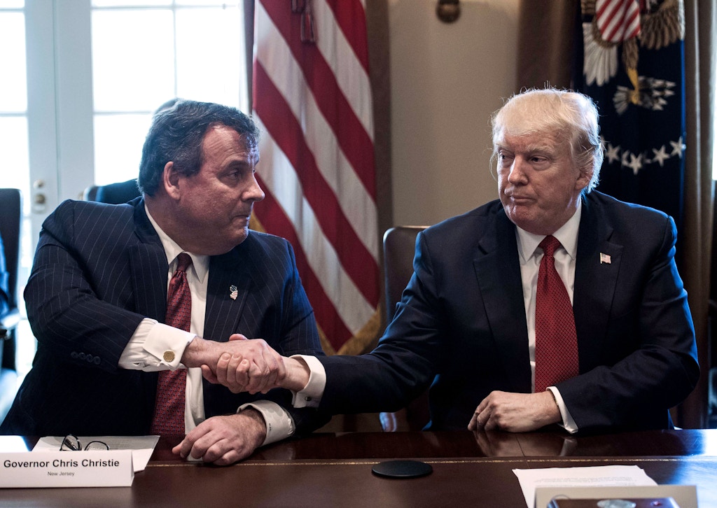 US President Donald Trump shakes hands with New Jersey Governor Chris Christie during a meeting about opioid and drug abuse in the Cabinet Room at the White House in Washington, DC, on March 29, 2017. / AFP PHOTO / NICHOLAS KAMM        (Photo credit should read NICHOLAS KAMM/AFP/Getty Images)
