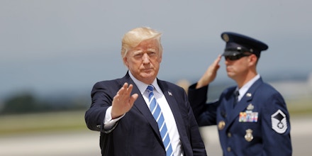 President Donald Trump waves after getting off Air Force One at Hagerstown Regional Airport in Hagerstown, Md., Aug. 18, 2017, en route to nearby Camp David, for a meeting with his national security team to discuss strategy for South Asia, including India, Pakistan and the way forward in Afghanistan.  (AP Photo/Pablo Martinez Monsivais)