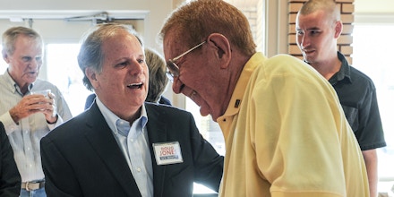 Candidate Doug Jones, left, jokes with former Alabama state Sen. Ray Campbell before a Democratic Senate candidate forum at the Princess Theatre in Decatur, Ala. Thursday, Aug. 3, 2017. (Jeronimo Nisa /The Decatur Daily via AP)