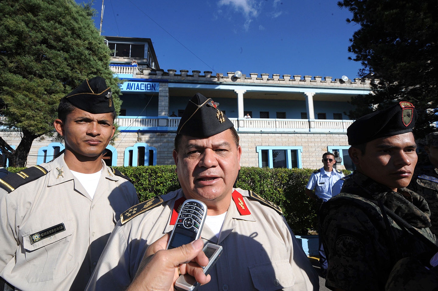 Honduran Chief of Joint Staff, Romeo Vasquez Velasquez (C), speaks to the press after overseeing the exit of ousted Honduran President Manuel Zelaya aboard the aircraft of Dominican President Leonel Fernandez in Tegucigalpa January 27, 2010. Zelaya and his family left Honduras Wednesday bound for the Dominican Republic after more than four months holed up in Brazil's embassy. The jet took off at 2135 GMT from the Tontontin airport amid hopes that the swearing-in of newly elected President Porfirio Lobo earlier in the day could end the turmoil triggered by Zelaya's June overthrow. AFP PHOTO/STR (Photo credit should read STR/AFP/Getty Images)