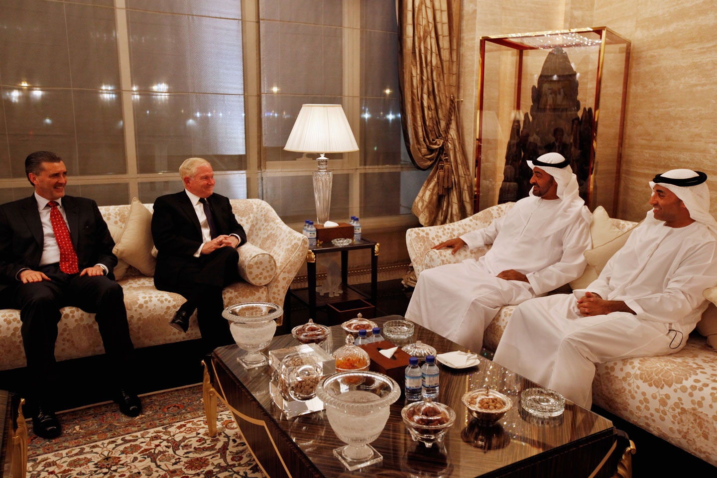 ABU DHABI, UNITED ARAB EMIRATES - APRIL 08:  U.S. Defense Secretary Robert Gates (2nd L) meets with Mohammed bin Zayed bin Sultan Al Nahyan (2nd R), the Crown Prince of Abu Dhabi and Deputy Supreme Commander of the United Arab Emirates Armed Forces, U.S. Ambassador to the UAE Richard Olson (L) and UAE Ambassador to the U.S. Yousef Al Otaiba (R) at the crown prince's home, the Mina Palace, April 8, 2011 in Abu Dhabi, United Arab Emirates. Gates visited Saudi Arabia and Iraq on this trip and will discuss the bilateral defense, and the unrest that is gripping the Mideast and Iran with the crown prince.  (Photo by Chip Somodevilla/Getty Images)