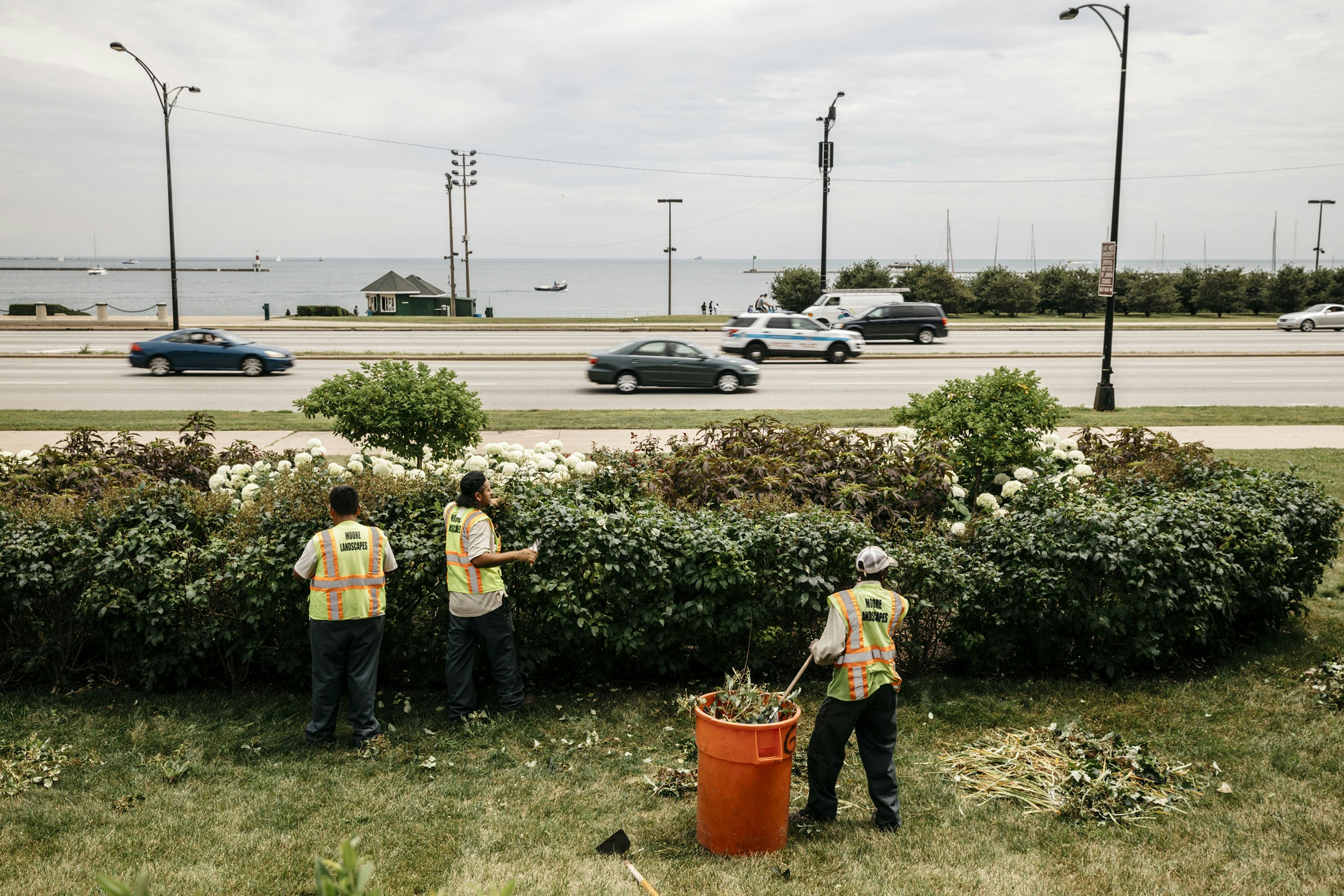 Chicago, IL - July 13, 2017 - Landscapers work across Lake Shore Drive from "Queens Landing", the location where Jedediah Brown parked his car near the shore of Lake Michigan and the incident with the Chicago Police Department's SWAT team ensued.