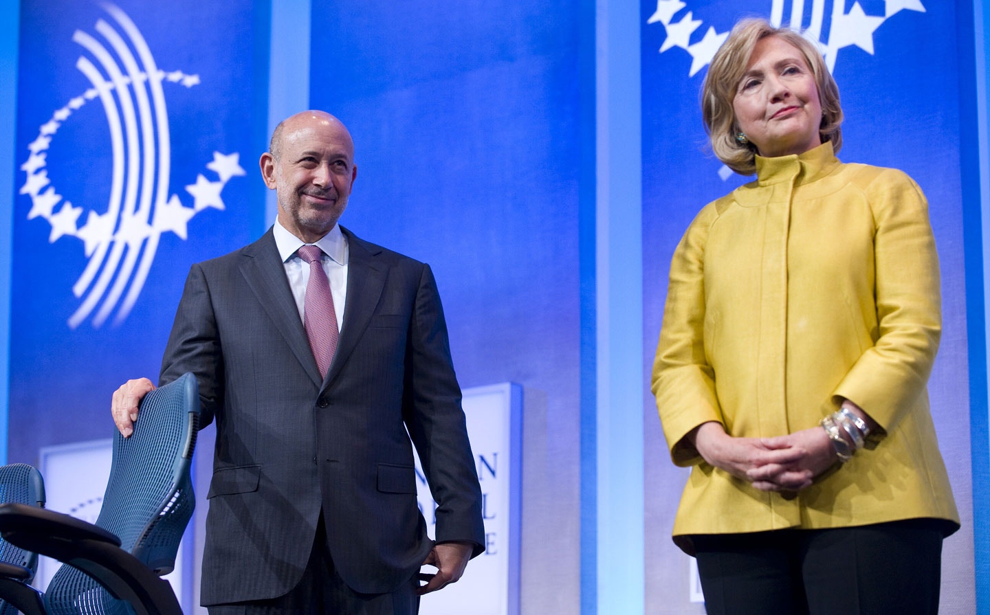 Lloyd Blankfein, Chairman & CEO, Goldman Sachs (L) stands on stage with former US Secretary of State Hillary Clinton during the 2014 Clinton Global Initiative annual meeting in New York September 24, 2014. AFP PHOTO/STEPHEN CHERNIN        (Photo credit should read STEPHEN CHERNIN/AFP/Getty Images)