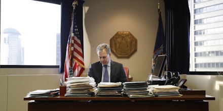 New York State Attorney General Eric Schneiderman sits at his desk in his office Friday, Feb. 17, 2017, in New York. (AP Photo/Frank Franklin II)