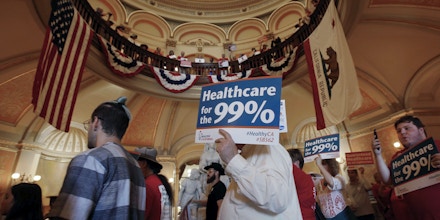 Members of the California Nurses Association and supporters rally in the rotunda at the Capitol calling for a single-payer health plan, Wednesday, June 28, 2017, in Sacramento, Calif. The demonstrators were demanding that Assembly Speaker Anthony Rendon, D-Paramount, bring a health care bill, SB562, by state Senators Ricardo Lara, D-Bell Garden, and Toni Atkins, D-San Diego, to a vote in the Assembly. (AP Photo/Rich Pedroncelli)