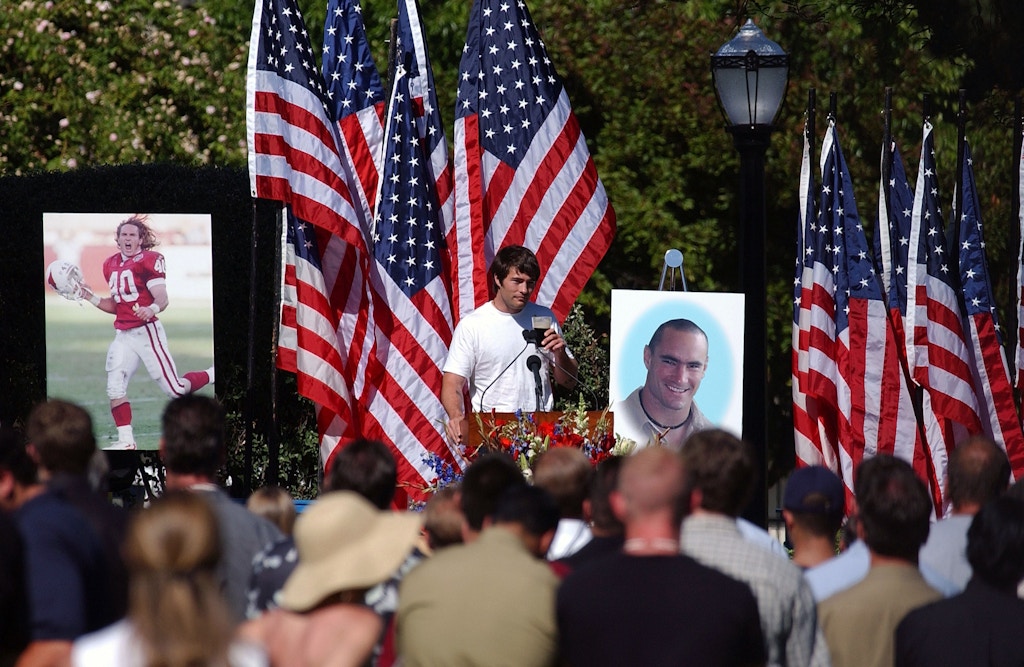 SAN JOSE, CA - MAY 3:  Richard Tillman, the brother of  Cpl. Pat Tillman, raises a toast with a glass of Guiness, as he speaks at a memorial service for his Tillman, who was killed in action in Afghanistan April 22, 2004, at the San Jose Municipal Rose Garden May 3, 2004 in San Jose, California.  Tillman turned down a lucrative NFL contract to serve with as a US Army Ranger.  (Photo by David Paul Morris/Getty Images)