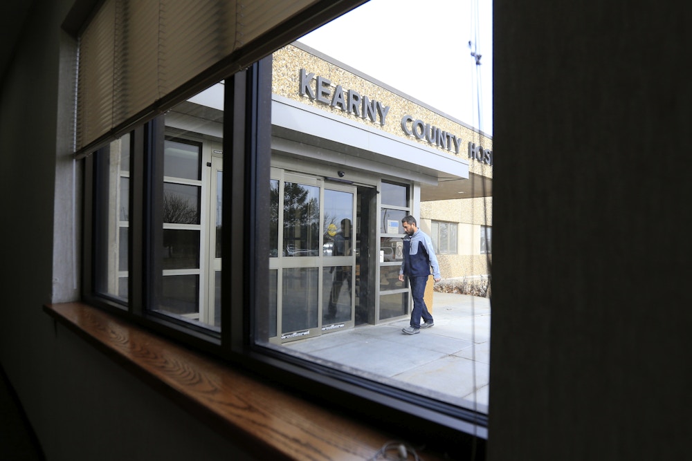 A visitor enters Kearny County Hospital in Lakin, Kan., Friday, Feb. 3, 2017. (AP Photo/Orlin Wagner)