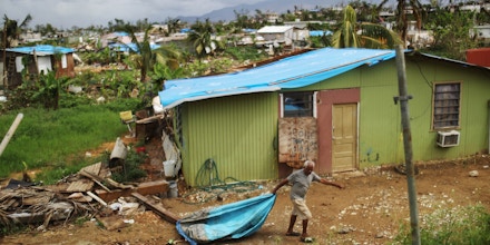 SAN ISIDRO, PUERTO RICO - OCTOBER 15:  A local resident cleans debris near his damaged home in an area without electricity on October 15, 2017 in San Isidro, Puerto Rico. Puerto Rico is suffering shortages of food and water in many areas and only 15 percent of grid electricity has been restored. Puerto Rico experienced widespread damage including most of the electrical, gas and water grid as well as agriculture after Hurricane Maria, a category 4 hurricane, swept through.  (Photo by Mario Tama/Getty Images)