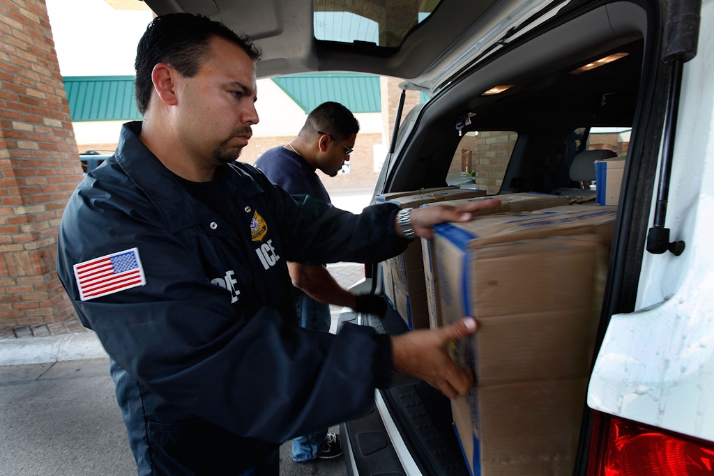 HIDALGO, TX - MAY 28:  Special agents from Immigration and Customs Enforcement (ICE) search a vehicle heading into Mexico at the Hidalgo border crossing on May 28, 2010 in Hidalgo, Texas. The inspection was part of a Department of Homeland Security (DHS) joint effort between ICE, Customs and Border Protection (CBP) and Customs and Border Patrol. The organizations are trying to slow the flow of guns, money and drugs from the United State into Mexico.  (Photo by Scott Olson/Getty Images)