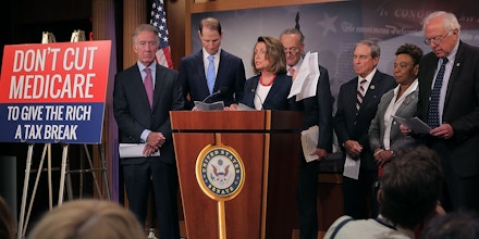 WASHINGTON, DC - OCTOBER 04:  (L-R) Rep. Richard Neal (D-MA), Senate Finance Committee ranking member Sen. Ron Wyden (D-OR), House Minority Leader Nancy Pelosi (D-CA), Senate Minority Leader Chuck Schumer (D-NY), House Budget Committee ranking member Rep. John Yarmuth (D-KY), Rep. Barbara Lee (D-CA) and Senate Budget Committee ranking member Sen. Bernie Sanders (I-VT) hold a news conference critical of the Republican tax and budget plan at the U.S. Capitol October 4, 2017 in Washington, DC. The Congressional Democrats called on President Donald Trump to keep his campaign promises to not cut entitlement programs like Social Security and Medicaid.  (Photo by Chip Somodevilla/Getty Images)