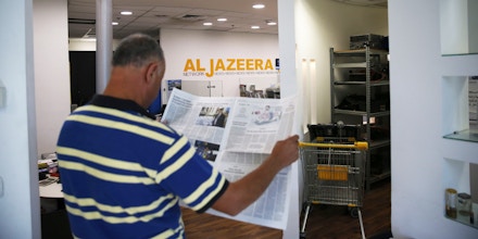 An employee of the Qatar based news network and TV channel Al-Jazeera is seen at the channel's Jerusalem office on July 31, 2017.Israel said on August 6, 2017 that it planned to close the offices of Al-Jazeera after Prime Minister Benjamin Netanyahu accused the Arab satellite news broadcaster of incitement. A statement from the communications ministry said it would demand the revocation of the credentials of journalists working for the channel and also cut its cable and satellite connections. / AFP PHOTO / AHMAD GHARABLI (Photo credit should read AHMAD GHARABLI/AFP/Getty Images)