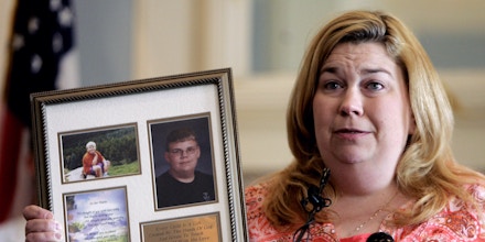 Tamra Weimer holds photos of her son, Andrew Weimer, who was 15 years old when he died from an ATV accident,  during a news conference in Oklahoma City, Wednesday, May 10, 2006, called to discuss the Oklahoma Legislature's failure to pass a bill aimed at reducing deaths due to children riding all-terrain vehicles. (AP Photo)