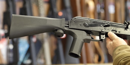 SALT LAKE CITY, UT - OCTOBER 5: A bump stock device, (left) that fits on a semi-automatic rifle to increase the firing speed, making it similar to a fully automatic rifle, is installed on a AK-47 semi-automatic rifle, (right) at a gun store on October 5, 2017 in Salt Lake City, Utah. Congress is talking about banning this device after it was reported to of been used in the Las Vegas shootings on October 1, 2017.  (Photo by George Frey/Getty Images)