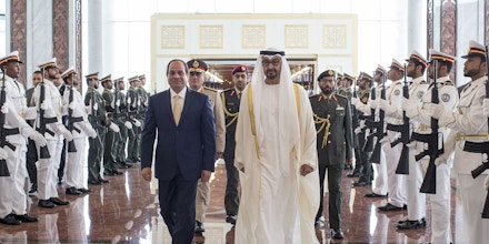 In this photo made available by Emirates News Agency, WAM, Sheikh Mohamed bin Zayed Al Nahyan, Crown Prince of Abu Dhabi and Deputy Supreme Commander of the UAE Armed Forces, right, receives Abdel-Fattah El-Sisi President of Egypt at The Presidential Airport in Abu Dhabi, United Arab Emirates. (Ryan Carter, Crown Prince Court via AP)