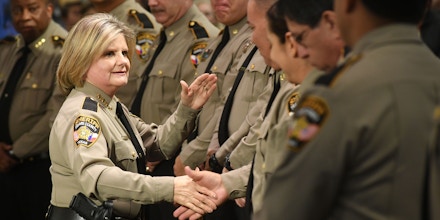 Sally Hernandez congratulates her command staff after swearing them in at a Swearing-In Ceremony on January 4, 2017