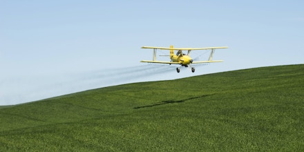 July 28, 2016 - USA, IDAHO, PALOUSE AREA, NEAR MOSCOW, BI-PLANE CROP-DUSTING WHEAT FIELD WITH PESTICIDE ..3rd August 1921 - First crop dusting of farm fields: A United States Army Air Service Curtiss JN4 Jenny piloted by John A. Macready was modified at McCook Field to spread lead arsenate to kill catalpa sphinx caterpillars at a Catalapa farm near Troy, Ohio (Credit Image: © Wolfgang Kaehler/UPPA via ZUMA Press)
