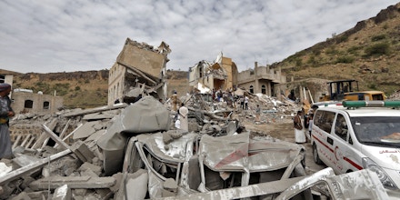 Emgergency services and Yemeni civilians search under the rubble of houses destroyed in an air strike in the residential southern Faj Attan district of the capital, Sanaa, on August 25, 2017.The attack destroyed two buildings in the southern district, leaving people buried under debris, witnesses and medics said. / AFP PHOTO / Mohammed HUWAIS (Photo credit should read MOHAMMED HUWAIS/AFP/Getty Images)