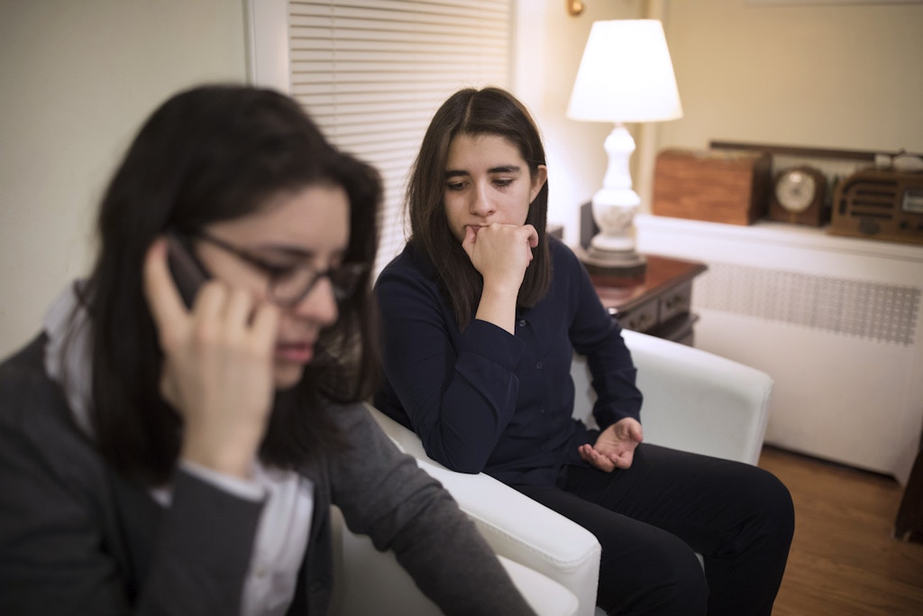 Twins and DACA recipients Liany Jr. Villacis-Guerrero and Maria Villacis-Guerrero in their home as Maria waits her turn to briefly talk to their father who is in detention and awaits removal to Ecuador, in Woodhaven, New York on Nov. 21, 2017.