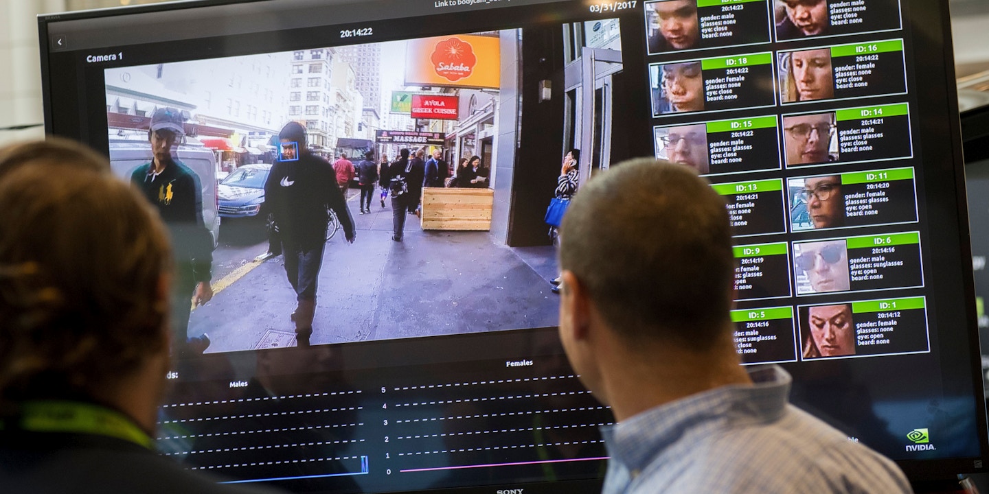 A display shows a facial recognition system for law enforcement during the NVIDIA GPU Technology Conference, which showcases artificial intelligence, deep learning, virtual reality and autonomous machines, in Washington, DC, November 1, 2017. / AFP PHOTO / SAUL LOEB (Photo credit should read SAUL LOEB/AFP/Getty Images)