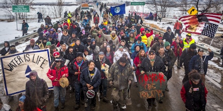 NORTH DAKOTA, UNITED STATES - 2017/02/22: Defiant Dakota Access Pipeline water protectors faced-off with various law enforcement agencies on the day the camp was slated to be raided. Many protesters and independent journalist, who were all threatened with multiple felony charges if they didn't leave were met with militarized police on the road abutting the camp. At least six were arrested, including a journalist who reportedly had sustained a broken hip. (Photo by Michael Nigro/Pacific Press/LightRocket via Getty Images)