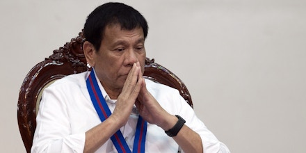 Philippine President Rodrigo Duterte attends the 115th Police Service Anniversary at the Philippine National Police (PNP) headquarters in Manila on August 17, 2016. Philippine President Rodrigo Duterte lashed out at the United Nations for criticising the growing number of killings under his anti-drug campaign, warning foreign human rights probers against coming to his country. / AFP / AFP POOL / NOEL CELIS (Photo credit should read NOEL CELIS/AFP/Getty Images)