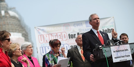 WASHINGTON, DC - JUNE 10:  Rep. Dan Lipinski (D-IL) (2nd R) and fellow Democratic members of Congress hold a news conference to voice their opposition to the Trans-Pacific Partnership trade deal at the U.S. Capitol June 10, 2015 in Washington, DC.  The congressional Republican leadership announced that the House will vote Friday to approve the TPP and give President Barack Obama fast-track authority to negotiate a large-scale trade deal.  (Photo by Chip Somodevilla/Getty Images)