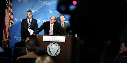 WASHINGTON, DC - JANUARY 03:  U.S. Federal Trade Commission Chairman Jon Leibowitz (2nd L) speaks as Bureau of Competition Director Richard Feinstein (L), and Bureau of Economics Director Howard Shelanski (R) listen during a news conference regarding the agency's 21-month-long investigation on Google January 3, 2013 at the FTC headquarters in Washington, DC. FTC announced that Google has agreed to change some of its business practices, including giving competitors access to standard-essential patents and letting advertisers to get more flexibility to use rival search engines, to resolve the agency's competition concerns in the markets for devices like smart phones, games and tablets and in online searching.  (Photo by Alex Wong/Getty Images)