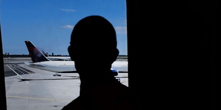 NEW YORK, NY - JUNE 26:  A man looks out at  planes at John F. Kennedy (JFK) international airport following an announcment by the Supreme Court that it will take President Donald Trump's travel ban case later in the year on June 26, 2017 in New York City. The court will let a limited version of the travel ban from six mostly muslim countries take effect before hearing full arguments in October.  (Photo by Spencer Platt/Getty Images)