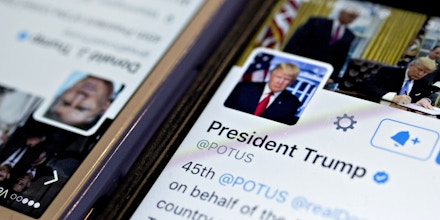 The Twitter Inc. account of U.S. President Donald Trump, @POTUS, is seen on an Apple Inc. iPhone arranged for a photograph in Washington, D.C., U.S., on Friday, Jan. 27, 2017. Mexican President Enrique Pena Nieto canceled a visit to the White House planned for next week after Trump on Thursday reinforced his demand, via Twitter, that Mexico pay for a barrier along the U.S. southern border to stem illegal immigration. Photographer: Andrew Harrer/Bloomberg via Getty Images