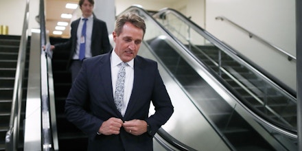 WASHINGTON, DC - NOVEMBER 30:  Sen. Jeff Flake (R-AZ) walks in the basement of the U.S. Capitol between votes November 30, 2017 in Washington, DC. Flake has yet to say how he will vote on the GOP tax reform bill that is being debated in the Senate.  (Photo by Chip Somodevilla/Getty Images)