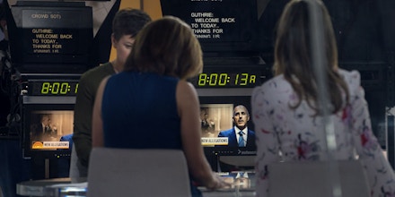 Co-anchors Hoda Kotb, center left, and Savannah Guthrie, right, sit on the set during a news segment of 