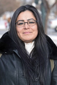 FILE - In this Dec. 8, 2017, file photo, Red Fawn Fallis, of Denver, stands outside the federal courthouse in Bismarck, N.D. A federal judge is refusing to delay the upcoming trial of Fallis, who is accused of shooting at law officers during protests in North Dakota against the Dakota Access pipeline. She's pleaded not guilty to federal civil disorder and weapons charges. Her trial begins Jan. 29, 2018., in Fargo, N.D. (Tom Stromme/The Bismarck Tribune via AP, File)