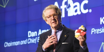 IMAGE DISTRIBUTED FOR AFLAC - Aflac CEO Dan Amos, displays the 2016 Aflac Holiday Duck, while speaking at the Chasing Cancer event at The Washington Post on Tuesday, Dec. 6, 2016, in Washington. Purchase a Holiday Duck at participating Macy's stores with all net proceeds going toward the treatment and research of children's cancer. (Kevin Wolf/AP Images for Aflac)