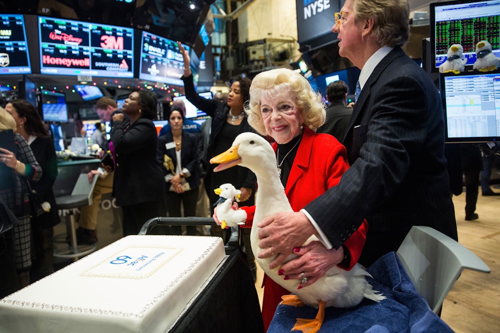 NEW YORK, NY - DECEMBER 04:  The Aflac duck visits the floor of the New York Stock Exchange after Aflac executives rang the closing bell during the afternoon of December 4, 2015 in New York City. The market closed more than 370 points up due to positive jobs report data.  (Photo by Andrew Burton/Getty Images)
