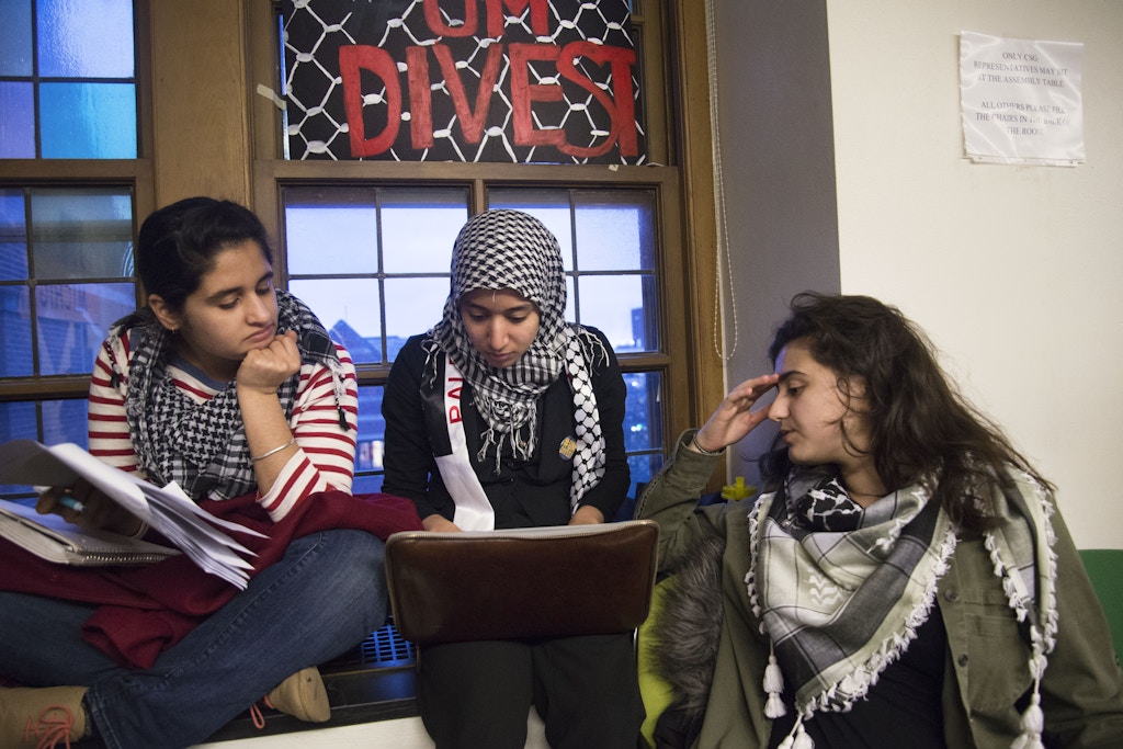 University of Michigan students participate in a sit in to divest from companies that have supported human rights violations against Palestinians on March 20, 2014.