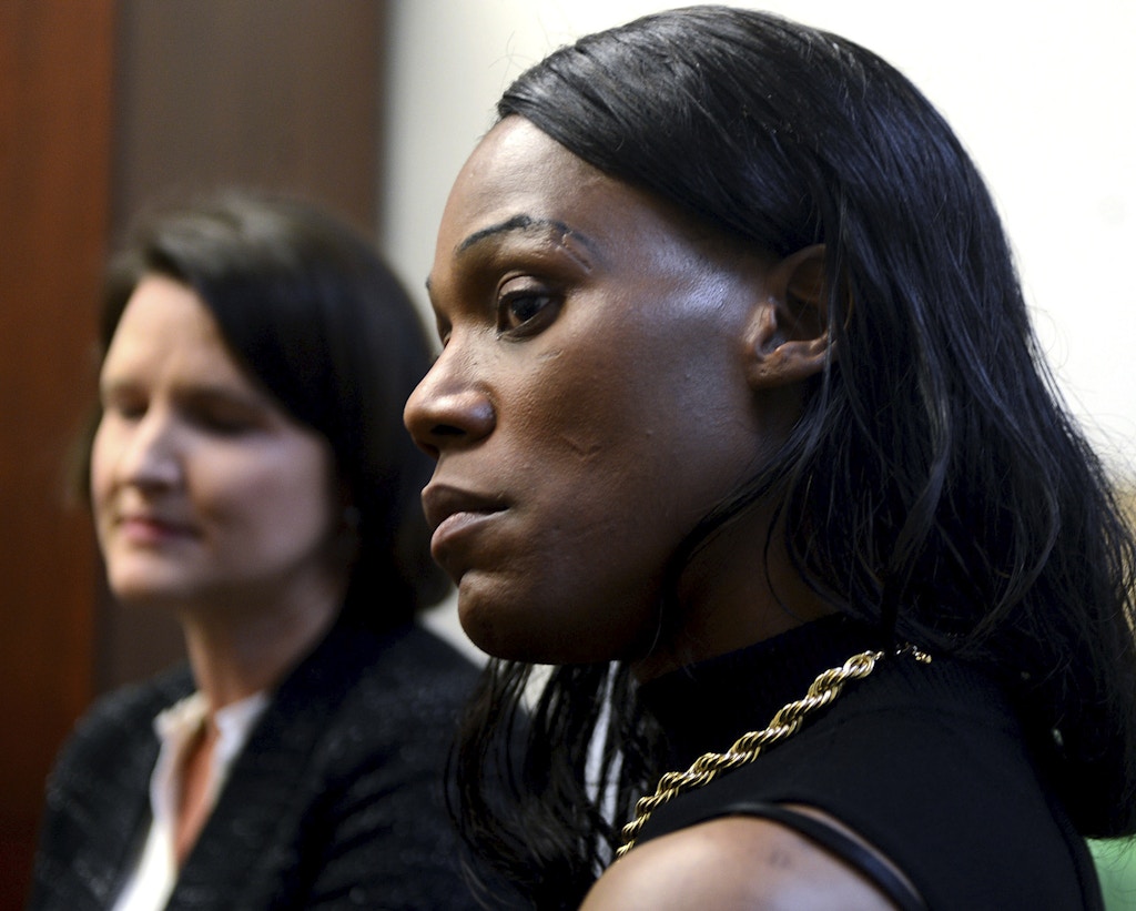 Jules Williams, 37, right, a transgender woman, looks on during a news conference following the filing of a lawsuit on her behalf by the American Civil Liberties Union of Pennsylvania against Allegheny County, Monday Nov. 6, 2017, in Pittsburgh. Williams claims that she was repeatedly physically and sexually assaulted during stays in the Allegheny County Jail because the staff refused to place her with female inmates. (Nate Guidry/Pittsburgh Post-Gazette via AP)