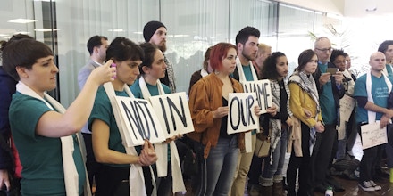 Demonstrators line up outside a meeting room protesting the New Orleans City Council vote rescinding a human rights resolution backed by Palestinian groups during a meeting in New Orleans, Thursday, Jan. 25, 2018. The Jan. 11 resolution encourages review of city investments or contracts involving businesses that violate human and civil rights. It mentions no nation, issue or business. But it's backed by a movement highly critical of Israel's policies toward the Palestinians. (AP Photo/Kevin McGill)