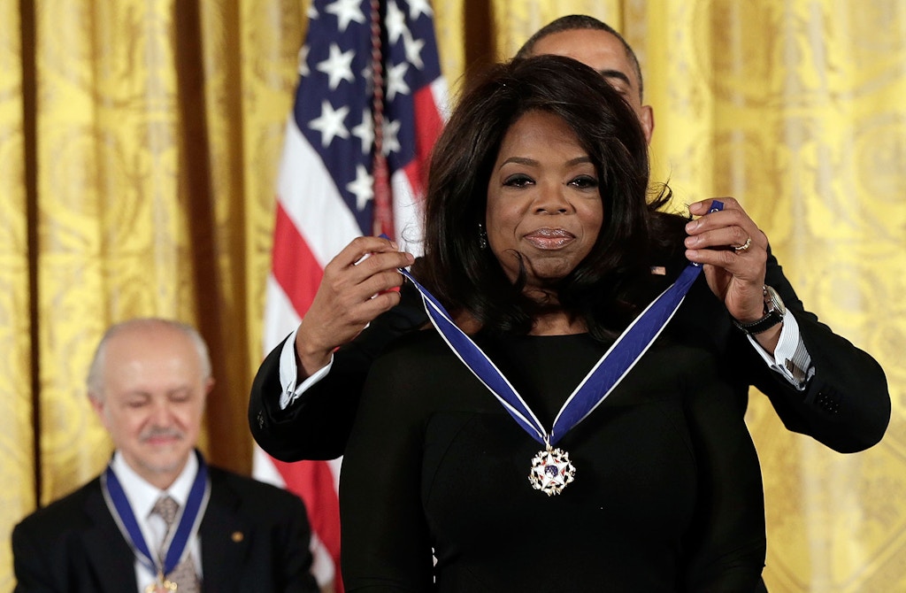 WASHINGTON, DC - NOVEMBER 20:  U.S. President Barack Obama awards the Presidential Medal of Freedom to Oprah Winfrey in the East Room at the White House on November 20, 2013 in Washington, DC. The Presidential Medal of Freedom is the nation's highest civilian honor, presented to individuals who have made meritorious contributions to the security or national interests of the United States, to world peace, or to cultural or other significant public or private endeavors. Also pictured is Mario Molina (L). (Photo by Win McNamee/Getty Images)
