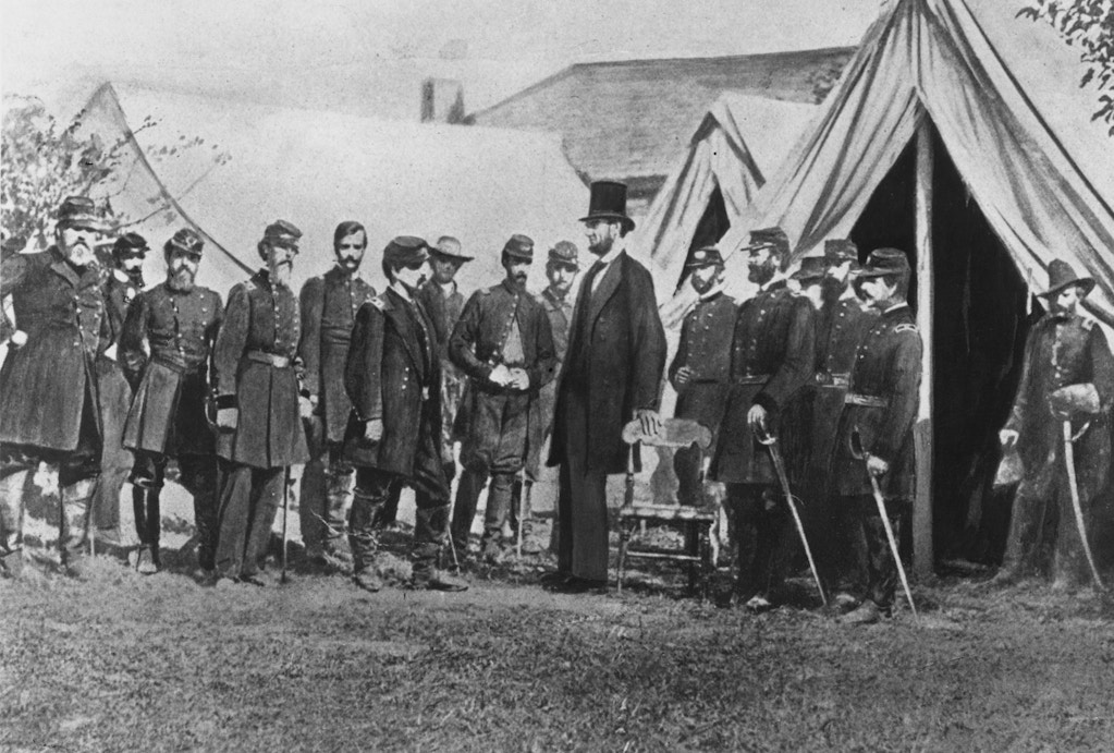1st October 1862:  President Abraham Lincoln visiting soldiers encamped at the Civil War battlefield of Antietam in Maryland. It was one of the bloodiest in the whole American Civil War.  (Photo by Rischgitz/Getty Images)