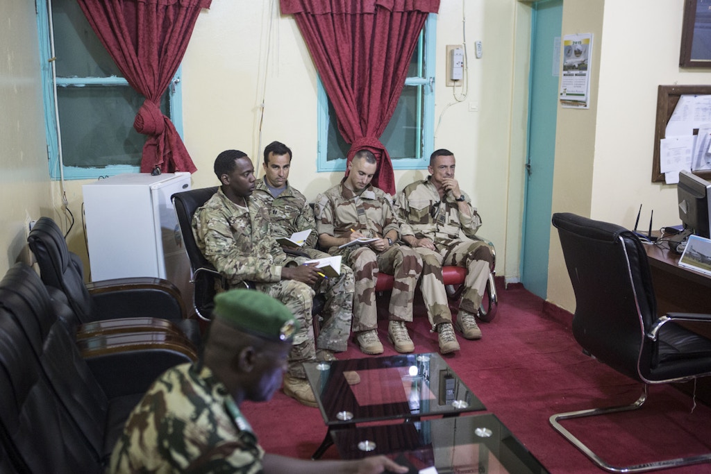 American and French soldiers attend a daily briefing with the Nigerien military commander in charge of the fight against Boko Haram (not pictured) at a Nigerien military base in Diffa, Niger, March 26, 2015.