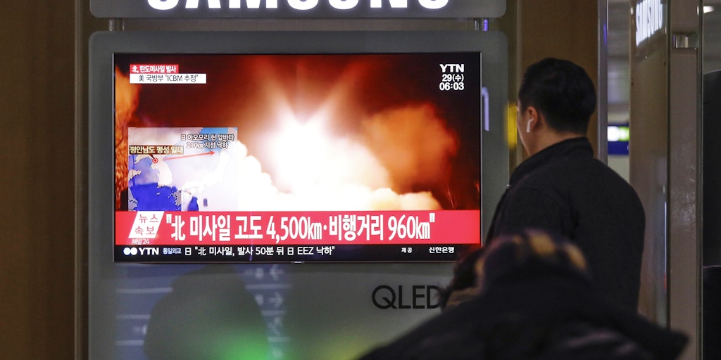 Nov 29, 2017-Seoul, South Korea-People watches a TV screen showing a local news program reporting North Korea's missile launch at the Seoul Train Station in Seoul, South Korea, Wednesday, Nov. 29, 2017. North Korea abruptly ended a 10-week pause in its weapons testing by launching what the Pentagon said was an intercontinental ballistic missile, apparently its longest-range test yet, a move that will escalate already high tensions with Washington. The Korean letters read "Fired ballistic missile."  (Photo by Seung-il Ryu/NurPhoto via Getty Images)