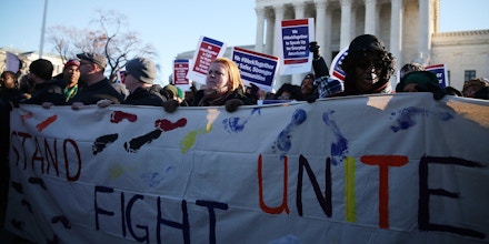 WASHINGTON, DC - JANUARY 11:  Pro union protesters rally in front of the US Supreme Court building January 11, 2016 in Washington, DC. The high court is hearing arguments inÊthe Friedrichs v. California Teachers Association case. The case will decide whether California and twenty two other states can make public-employees, such as public school teacher Rebecca Friedrichs, to pay union agency fees.  (Photo by Mark Wilson/Getty Images)