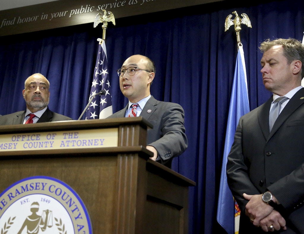 Ramsey County Attorney John Choi, center, surrounded by other law enforcement officials, announces Wednesday, Nov. 16, 2016, that Minnesota police officer Jeronimo Yanez has been charged with second-degree manslaughter in the killing of Philando Castile, a black man whose girlfriend streamed the gruesome aftermath of the fatal shooting live on Facebook. Standing to Choi's left is Don Lewis, special prosecutor in the case and to his right is Richard Dusterhoft, criminal division director at the Ramsey County DA's office.  (David Joles /Star Tribune via AP)