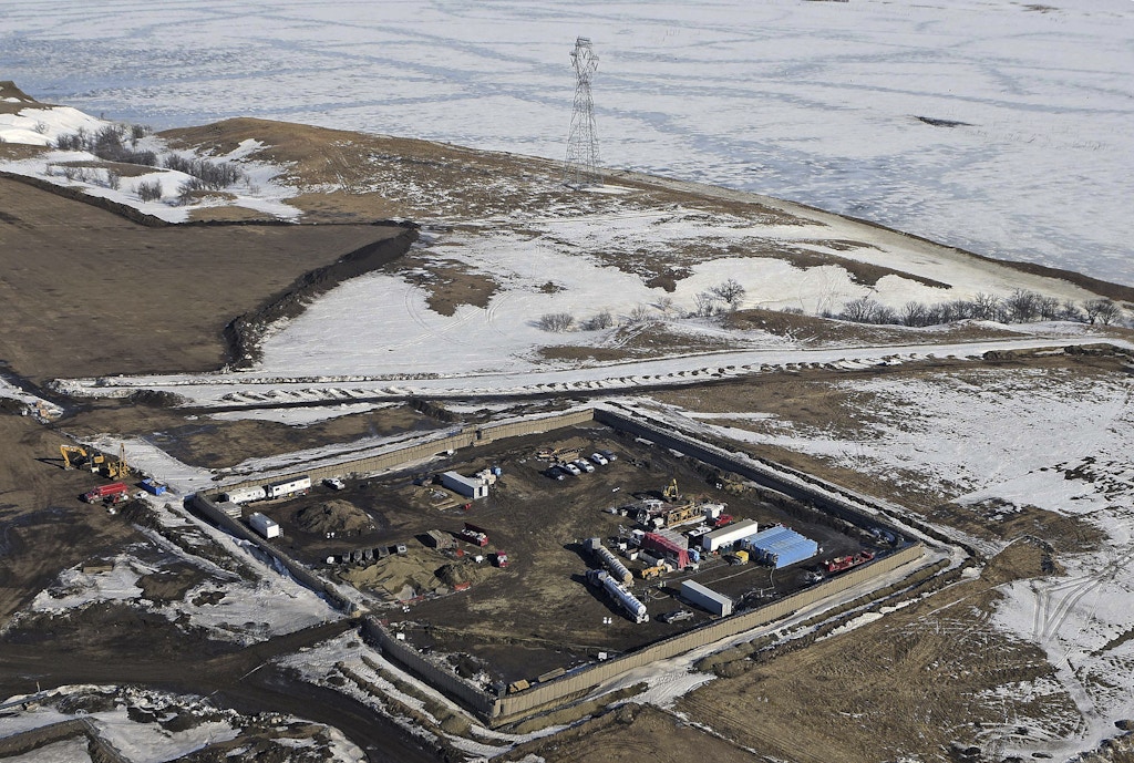 FILE - In this Feb. 13, 2017, aerial file photo shows the site where the final phase of the Dakota Access pipeline will take place with boring equipment routing the pipeline underground and across Lake Oahe to connect with the existing pipeline in Emmons County near Cannon Ball, N.D. Environmental activists who tried to disrupt some oil pipeline operations in four states to protest the pipeline say they aren't responsible for any recent attacks on that pipeline. Dakota Access developer Energy Transfer Partners said in court documents Monday, March 20, 2017, that there have been "coordinated physical attacks" along the $3.8 billion pipeline that will carry oil from North Dakota to Illinois. (Tom Stromme/The Bismarck Tribune via AP, File)