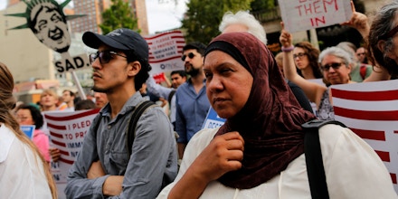 People take part in a rally to protest restrictive guidelines issued by the US on who qualifies as a close familial relationship under the Supreme Court order on the Muslim and refugee ban at Union Square on June 29, 2017, in New York.US President Donald Trump's five-month effort to implement a promised ban on travelers from six mostly Muslim countries and on all refugees takes effect late Thursday, July 29, 2017 as controversy swirls over who qualifies for an exemption based on family ties. / AFP PHOTO / EDUARDO MUNOZ ALVAREZ (Photo credit should read EDUARDO MUNOZ ALVAREZ/AFP/Getty Images)