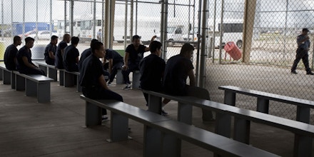 Raymondville, UNITED STATES: Detainees wait to be processed inside Homeland Security's Willacy Detention Center, a facility with 10 giant tents that can house up to 2000 detained illegal immigrants, 10 May 2007 in Raymondville, Texas. The 65 million USD facility was constructed as part of Secure Border Initative last July and now where many of the former 