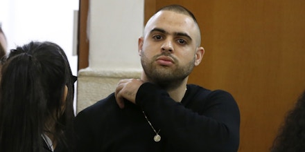 Ben Deri (C), a 24-year-old Israeli policeman accused of killing a Palestinian teenager in 2014 during clashes in Beitunia in the occupied West Bank, is seen at the district court in Jerusalem on April 25, 2018. - The Israeli court sentenced Deri to nine months in jail for the fatal shooting of a Palestinian teenager in 2014, an incident documented by video footage. He was found guilty of negligent homicide and also ordered to pay 50,000 shekels ($14,000) to the family of the then-17-year-old Nadeem Nuwarah. (Photo by AHMAD GHARABLI / AFP) (Photo credit should read AHMAD GHARABLI/AFP/Getty Images)