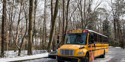 ATLANTA, GA - JANUARY 29: An abandoned Atlanta Public School bus sits in the ice on Howell Mill Road during the winter storm January 29, 2014 in Atlanta, Georgia. Drivers and kids on school buses were stuck in their vehicles overnight as the wintery weather and accidents snarled roads and highways thoughout the region.  (Photo by Daniel Shirey/Getty Images)